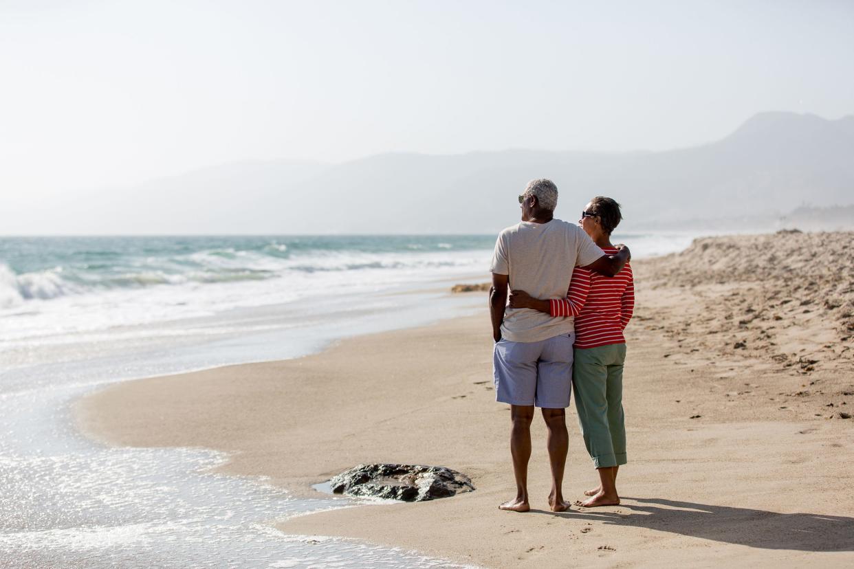 senior couple enjoying the view on the beach