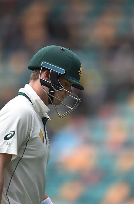 Australian captain Steve Smith departs after being dismissed by South African bowler Kagiso Rabada for 31 runs on day four of the 2nd Test match between Australia and South Africa. Photo: AAP