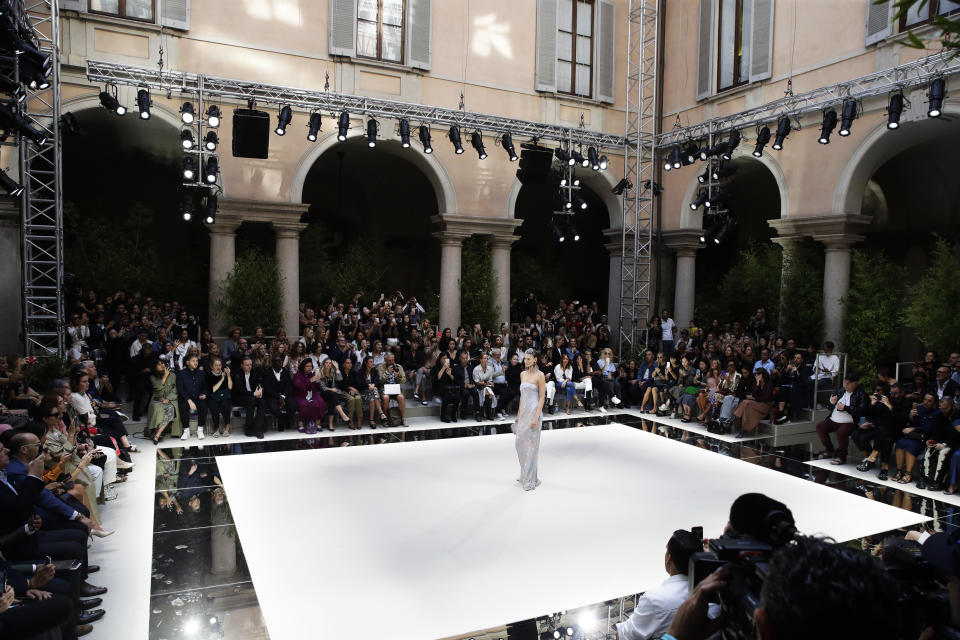 A model wears a creation as part of the Armani Spring-Summer 2020 collection, unveiled during the fashion week, in Milan, Italy, Saturday, Sept. 21, 2019. (AP Photo/Luca Bruno)