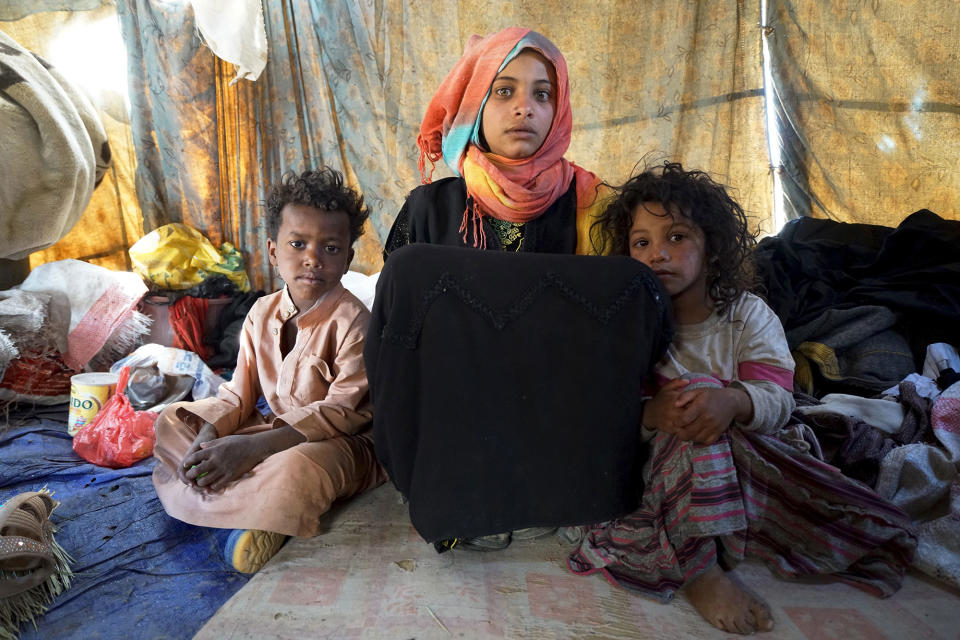 <p>Khamir IDP Settlement, Amran Governorate, Yemen, April 14, 2017: Ibtissam, a 15-year-old orphan girl lives in a ragged tent with her 7 siblings, in an IDP settlement in Khamir, about 100 km north of the capital Sana’a. The settlement houses more than 400 internally displaced families. Ibtissam fled here from the northern city of Saada. Her father was killed when her hometown was attacked in 2015 and her mother died of a stroke shortly after. Ibtissam and her siblings are among the more than 3 million people who have fled their homes in search for safety and security since the escalation of the conflict in 2015. (Photograph by Giles Clarke for UN OCHA/Getty Images) </p>