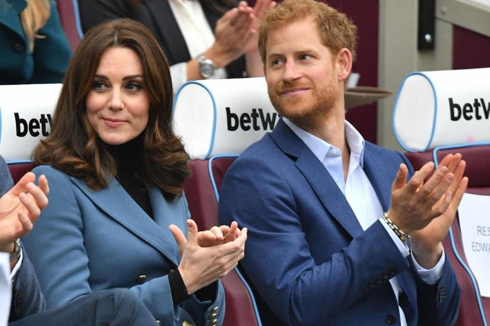 The Duchess of Cambridge and Prince Harry applaud as they attend the graduation ceremony for more than 150 Coach Core apprentices (PA)