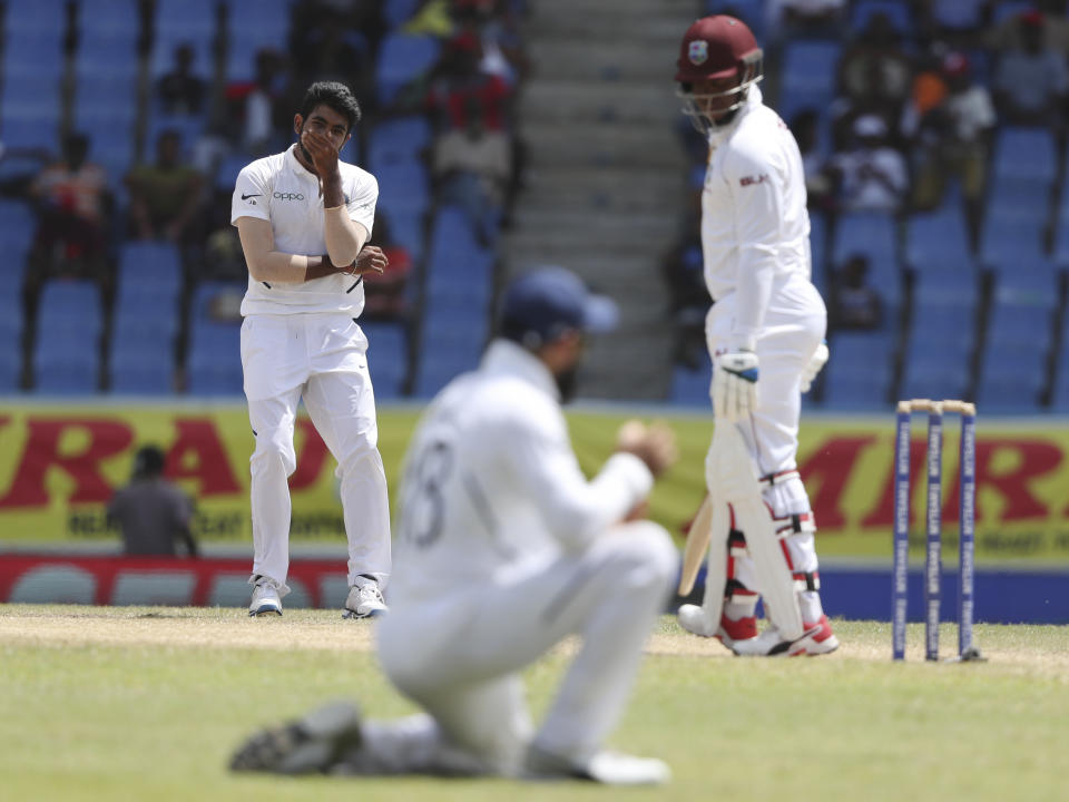 India's bowler Jasprit Bumrah gestures after captain Virat Kohli dropped the catch of a shot played by West Indies' Shimron Hetmyer during day four of the first Test cricket match at the Sir Vivian Richards cricket ground in North Sound, Antigua and Barbuda, Sunday, Aug. 25, 2019. (AP Photo/Ricardo Mazalan)