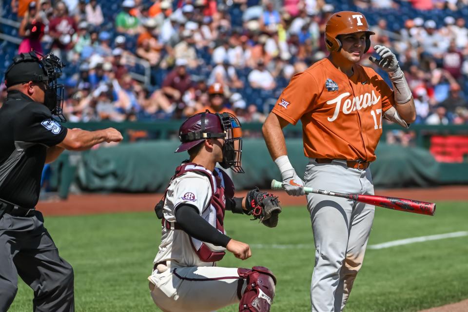 Texas first baseman Ivan Melendez reacts after a called third strike in the sixth inning with two outs and the bases loaded. The Longhorns' potent offense went cold in Omaha, producing just one extra-base hit and scoring only five total runs.