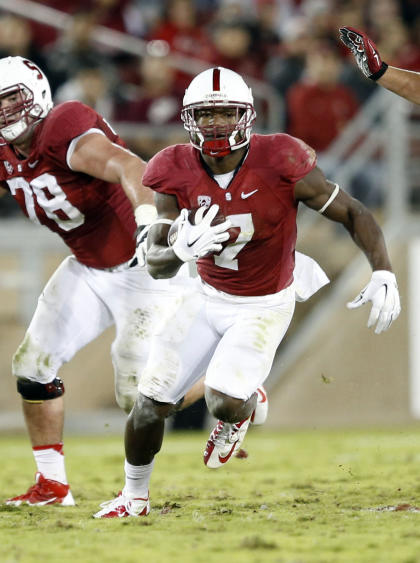 Nov 15, 2014; Stanford, CA, USA; Stanford Cardinal wide receiver Ty Montgomery (7) gains a first down during the fourth quarter against the Utah Utes at Stanford Stadium. Utah won 20-17 in double overtime. (Bob Stanton-USA TODAY Sports)