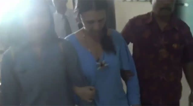 Ms Connor being escorted from her cell. Source: 7News