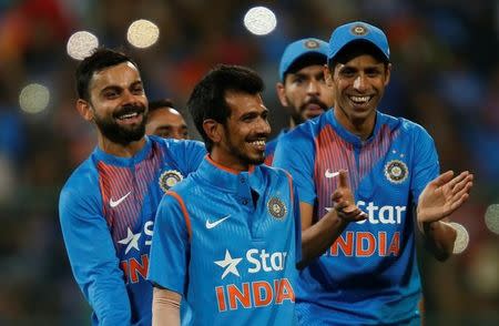 Cricket - India v England - Third T20 International - M Chinnaswamy Stadium, Bengaluru, India - 01/02/17. India's Yuzvendra Chahal (C) celebrates with team mates after winning the match. REUTERS/Danish Siddiqui