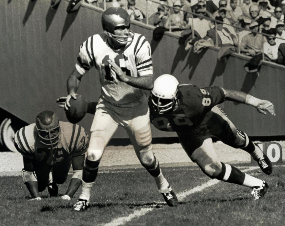 Oct 22, 1967; Unknown location, USA; FILE PHOTO; Philadelphia Eagles quarterback Norm Snead (16) in action against the St. Louis Cardinals defensive end Dave Long (89). The Cardinals beat the Eagles 48-14. Mandatory Credit: Malcolm Emmons-USA TODAY Sports