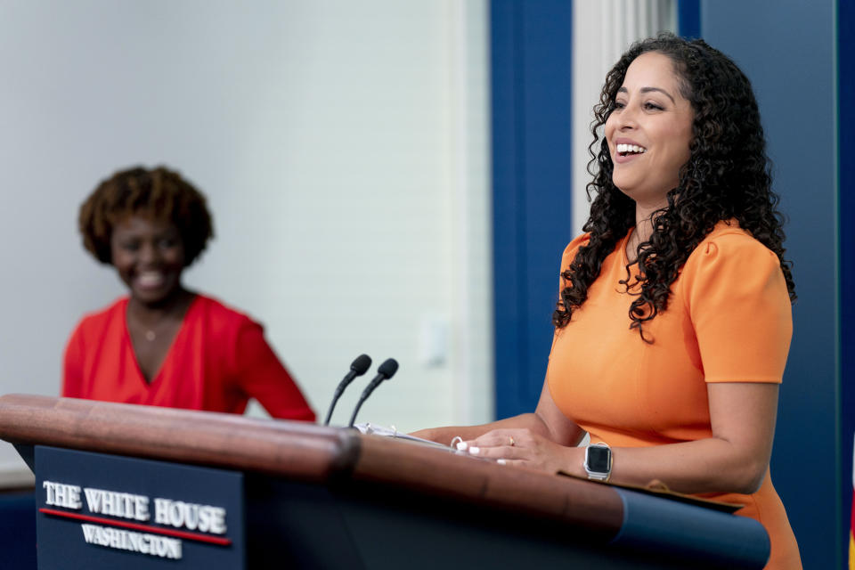 FILE - White House Hispanic Media Director Luisana Perez Fernandez, right, takes the podium from White House press secretary Karine Jean-Pierre, left, to speak a press briefing at the White House in Washington, Sept. 15, 2022. President Joe Biden's past missteps when courting Hispanic voters have some activists worried that his reelection campaign won't get crucial details right before the 2024 election. Biden's supporters counter that Democrats maintain an advantage on policies that matter to Hispanic voters.(AP Photo/Andrew Harnik, File)