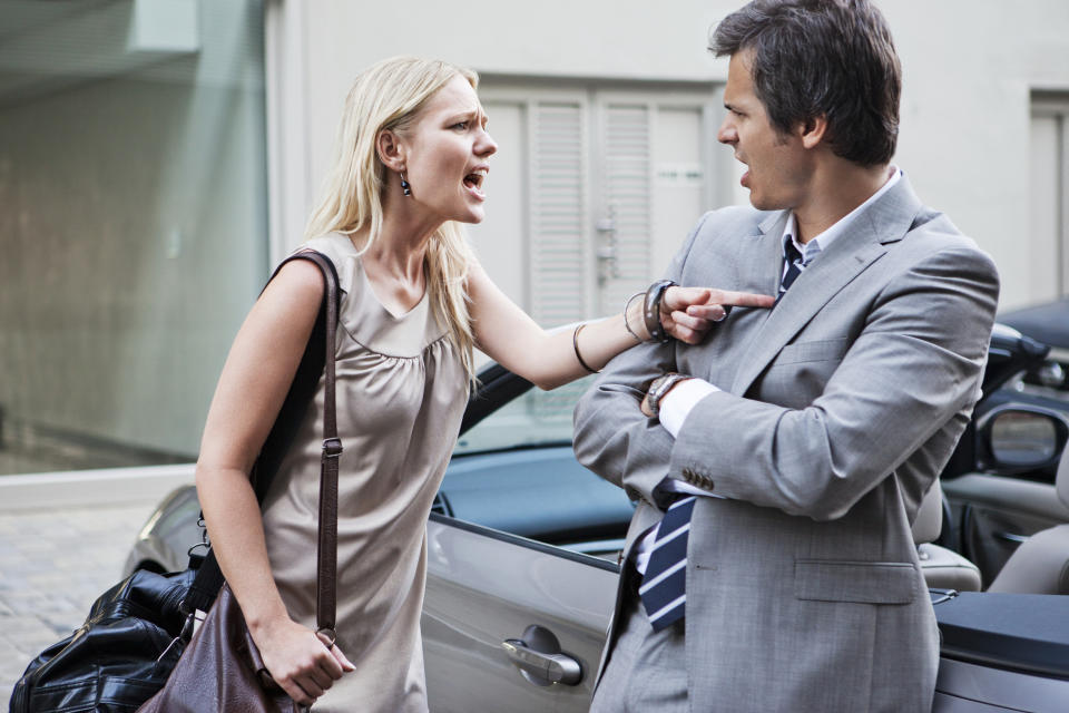 a woman yelling at a man