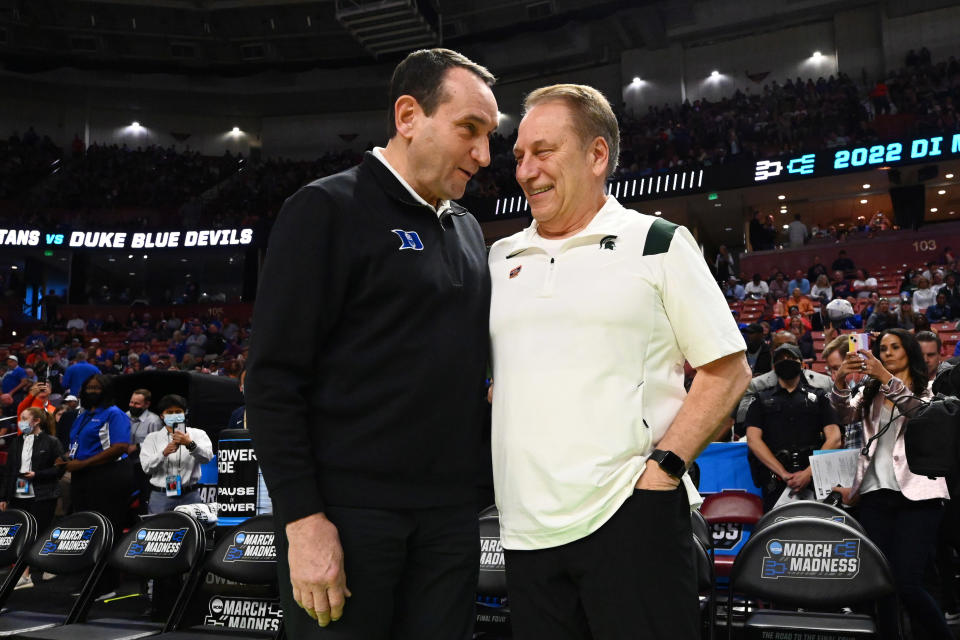 GREENVILLE, SC - MARCH 20: Head coach Mike Krzyzewski of the Duke Blue Devils and head coach Tom Izzo of the Michigan State Spartans talk before their game during the second round of the 2022 NCAA Men's Basketball Tournament held at Bon Secours Wellness Arena on March 20, 2022 in Greenville, South Carolina. (Photo by Grant Halverson/NCAA Photos via Getty Images)