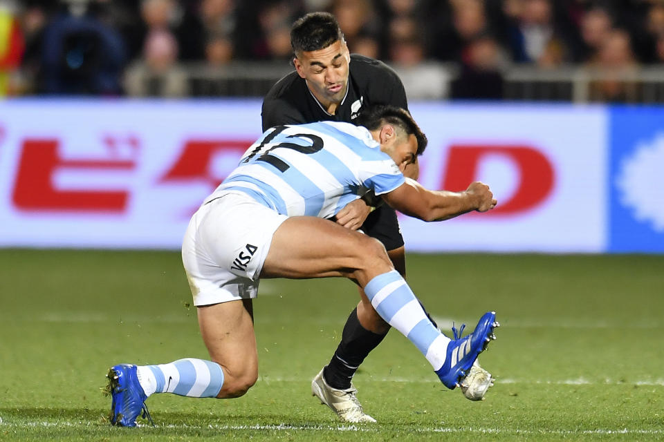 Rieko Ioane of New Zealand, top, is tackled by Matias Orlando of Argentina during their Rugby Championship test match in Christchurch, New Zealand, Saturday, Aug. 27, 2022. (John Davidson/Photosport via AP)