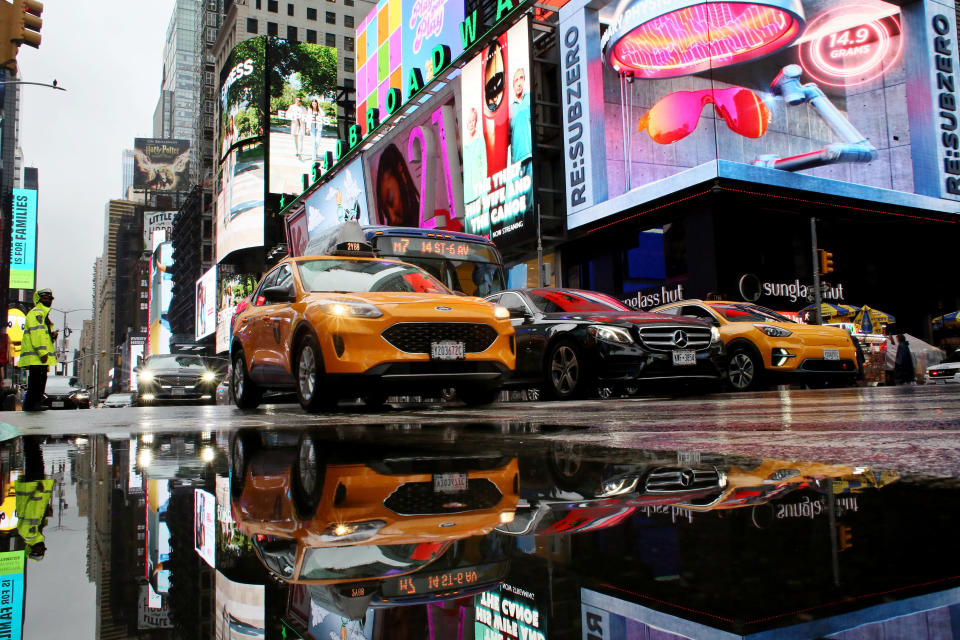 Cars drive through Times Square 