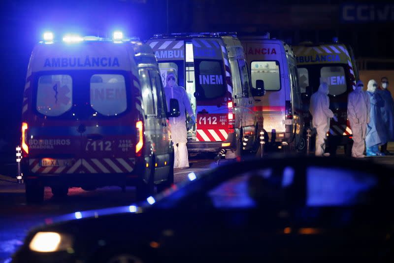 Ambulances with COVID-19 patients are seen waiting in Santa Maria hospital, as COVID-19 patients are being transferred from another hospital after a oxygen supply malfunction, amid the coronavirus disease (COVID-19) pandemic in Lisbon