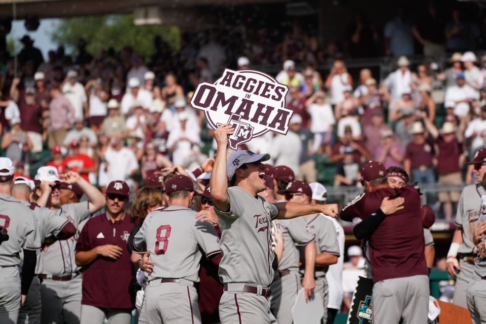 Texas A&M pitcher Micah Dallas, center, celebrates the Aggies' super regional win over Louisville last Saturday. A&M will open the College World Series on Friday against Oklahoma.