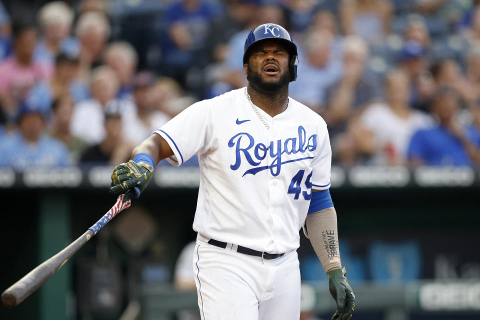 Kansas City Royals' Hanser Alberto reacts after getting hit by a pitch during the third inning of a baseball game against the Chicago White Sox at Kauffman Stadium in Kansas City, Mo., Monday, July 26, 2021. (AP Photo/Colin E. Braley)