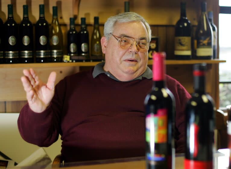 Fred Franzia, CEO of Bronco Wine Co., gestures during an interview in his combination conference and tasting room at the winery's headquarters in Ceres, Calif., Jan. 11, 2005. Central California vintner Fred Franzia, who has been fighting a state law requiring that wines with "Napa" on the label be made from grapes grown in that exclusive region, is releasing two new wines under his Napa Creek label, both going for $3.99 a bottle. The twist: This time the wines are actually made with grapes from Napa.(AP Photo/Eric Risberg) ORG XMIT: NY847