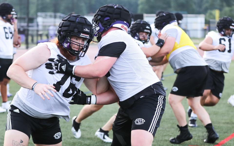 Stonehill's Nick Tinkham goes through an offensive line drill during the first day of practice at W.B. Mason Stadium on Monday, Aug. 7, 2023.