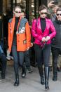 <p>Gigi in a slightly-oversized orange leather jacket adorned with bright blue studs and comic motifs from Prada's Spring 2018 collection, paired with a simple black turtleneck, plaid pants, and side-laced combat boots.</p><p>Bella wearing a fitted magenta patent leather blazer by Georgine, cinched at the waist with a gold vintage Chanel chainlink belt from <a href="https://www.whatgoesaroundnyc.com/chanel-quilted-cc-chain-belt-q6a01m17db078.html" rel="nofollow noopener" target="_blank" data-ylk="slk:What Goes Around Comes Around;elm:context_link;itc:0;sec:content-canvas" class="link ">What Goes Around Comes Around</a>, a similar turtleneck, black pants, and knee-high boots while out in Paris.</p>