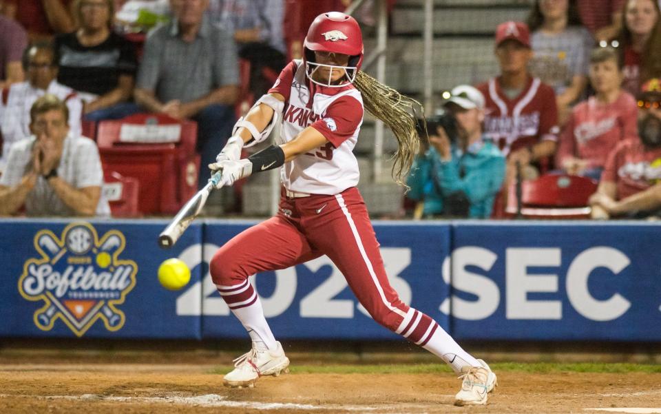 May 11, 2023; Fayetteville, AK, USA; Arkansas Razorbacks outfielder Reagan Johnson (23) slaps the ball during a quarterfinal game against the Alabama Crimson Tide in the SEC Softball Tournament. Mandatory Credit: Brett Rojo-USA TODAY Sports