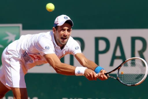 Novak Djokovic hits a return on his way to victory over Tomas Berdych in Monte Carlo on Saturday. Djokovic battled into his second career final in the Monte Carlo Masters, overcoming a stiff challenge from Berdych 4-6, 6-3, 6-2