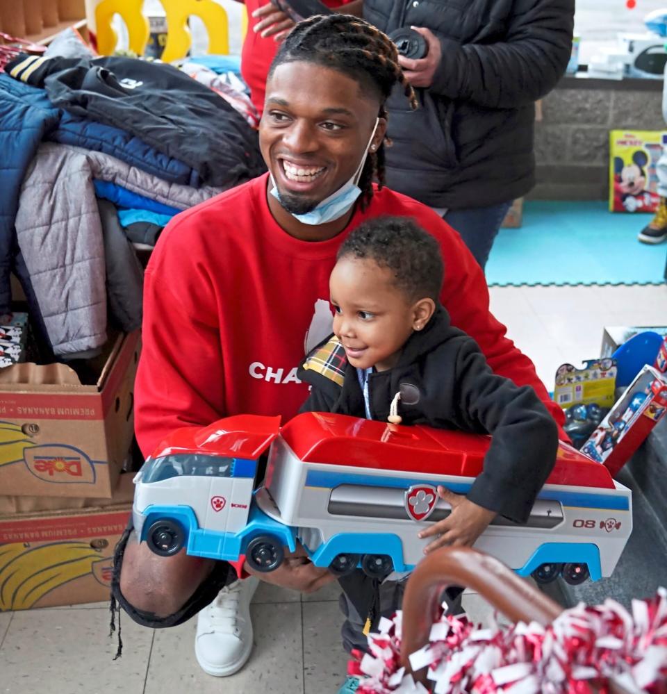 Pittsburgh defensive back Damar Hamlin poses for a photo with Bryce Williams, 3, of McKees Rocks, Pa., after the youngster picked out a toy during Hamlin's Chasing M's Foundation community toy drive at Kelly and Nina's Daycare Center, Tuesday, Dec. 22, 2020, in McKees Rocks, Pa. (Matt Freed/Pittsburgh Post-Gazette via AP)