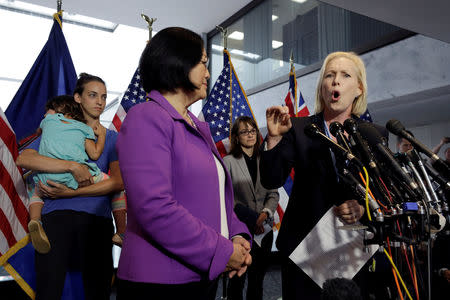 Senator Kirsten Gillibrand (D-NY) speaks at a news conference with U.S. Senator Mazie Hirono (D-HI) with Holton-Arms high school alumnae Kate Gold (L), Alexis Goldstein (C) and other graduates to release a letter from more than a thousand graduates of the school supporting Dr. Christine Blasey Ford and their belief in her accusations against President Donald Trump's U.S. Supreme Court nominee Brett Kavanaugh on Capitol Hill in Washington, U.S., September 20, 2018. REUTERS/Yuri Gripas