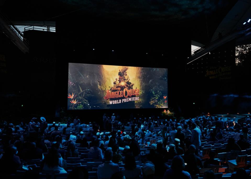 People gather in the theater to watch the premiere.