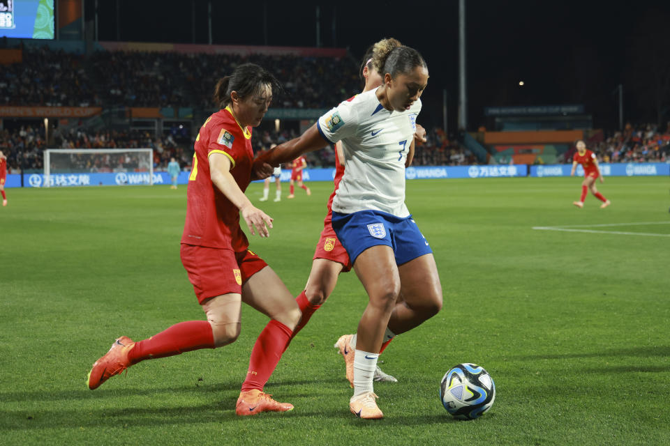 England's Lauren James, right, battle for control of the ball with China's Wu Haiyan during the Women's World Cup Group D soccer match between China and England in Adelaide, Australia, Tuesday, Aug. 1, 2023. (AP Photo/James Elsby)