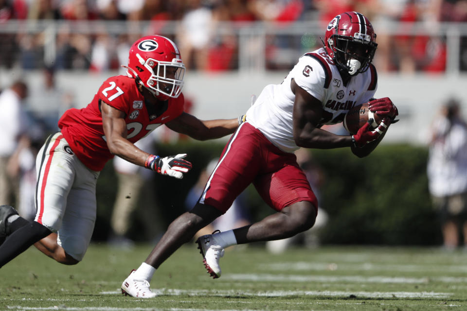 South Carolina wide receiver Bryan Edwards (89) makes a catch as Georgia defensive back Eric Stokes (27) defends in the first half of an NCAA college football game Saturday, Oct. 12, 2019, in Athens, Ga. (AP Photo/John Bazemore)