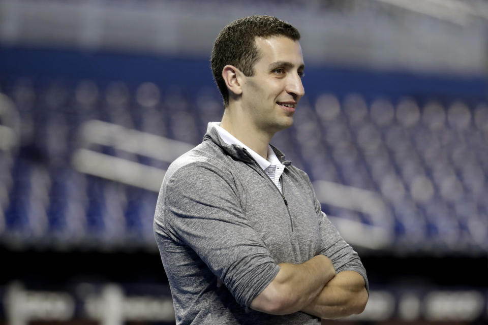 FILE - In this Sept. 11, 2019, file photo, Milwaukee Brewers general manager David Stearns stands on the field before a baseball game against the Miami Marlins, in Miami. Major League Baseball will start each extra inning this season by putting a runner on second base. Stearns, who says he’s long advocated this change, noted a game that lasts at least 15 innings “can impact you for weeks after that if they are compounded by other challenging games.” (AP Photo/Lynne Sladky, File)