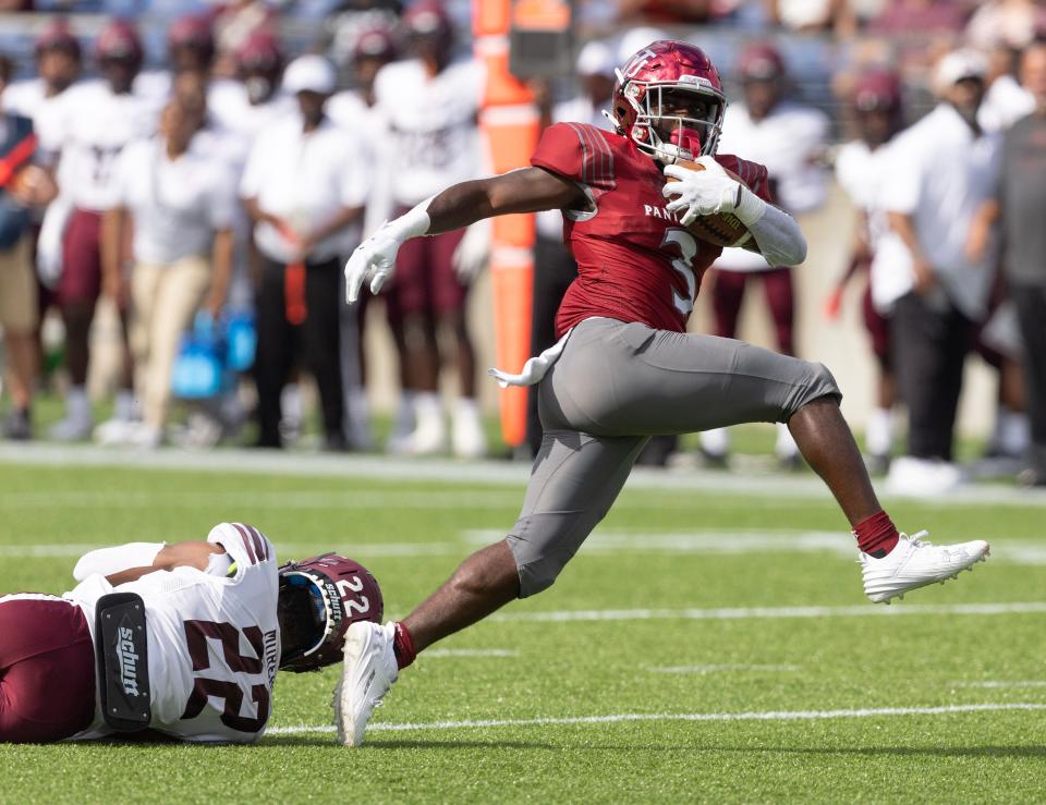 Virginia Union running back Jada Byers breaks the tackle of Morehouse's Cameron Selders as he runs for a first-half touchdown in the Black College Football Hall of Fame Classic, Sunday, in Canton.
