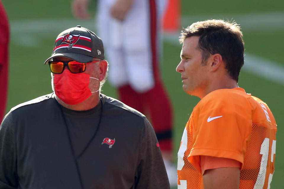 Tom Brady talks with Bruce Arians during training camp.