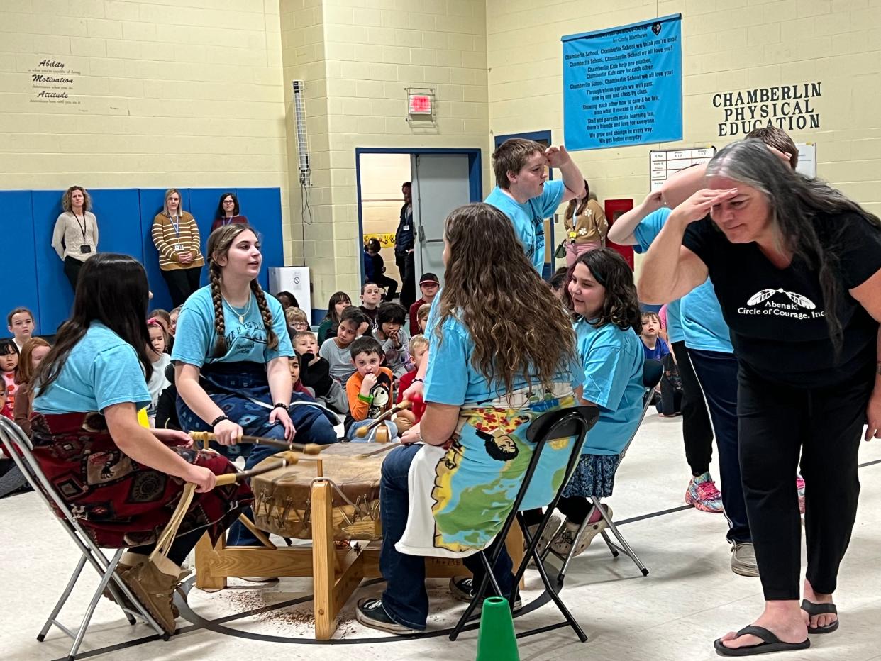 Brenda Gagne, right, newly elected chief of the Abenaki Nation of Missisquoi, leads students through a dance accompanying drummers from the Abenaki Circle of Courage. Gagne runs the after-school program in Swanton that celebrates Abenaki heritage, including teaching traditional Abenaki songs. The group was at Gertrude Chamberlin School in South Burlington to perform and also to display the Abenaki Nation of Missisquoi flag at the school, a first outside of Franklin and Grand Isle counties, on Nov. 14, 2023.