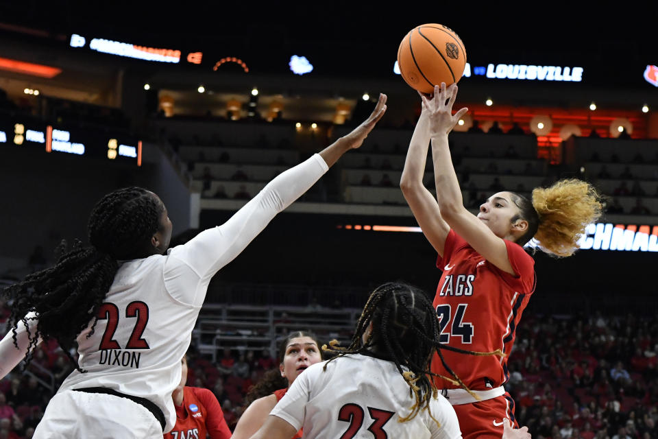 Gonzaga guard Mckayla Wiliams (24) shoots over Louisville forward Liz Dixon (22) during the first half of a women's NCAA tournament college basketball second-round game in Louisville, Ky., Sunday, March 20, 2022. (AP Photo/Timothy D. Easley)
