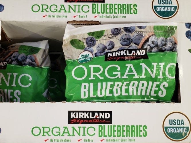 Bags of frozen blueberries in white boxes at Costco