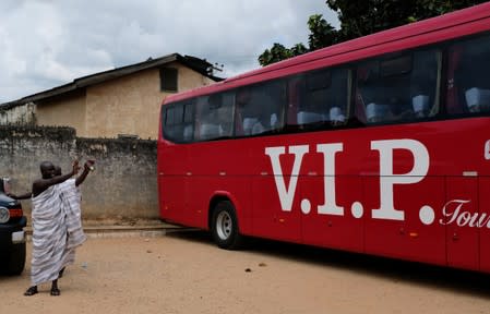 Residents of Nkwantakese bid farewell to members of a heritage tour group after their visit to the Chief's palace in Ashanti region