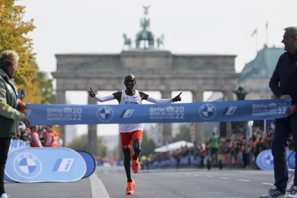 Kenya's Eliud Kipchoge crosses the line to win the Berlin Marathon in Berlin, Germany, Sunday, Sept. 25, 2022. Olympic champion Eliud Kipchoge has bettered his own world record in the Berlin Marathon. Kipchoge clocked 2:01:09 on Sunday to shave 30 seconds off his previous best-mark of 2:01:39 from the same course in 2018. (AP Photo/Christoph Soeder)