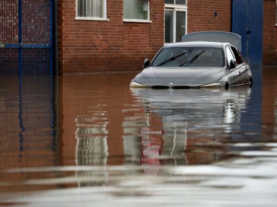 A car partially submerged in floods in Shrewsbury, Shropshire (Oli Scarff/AFP/Getty)