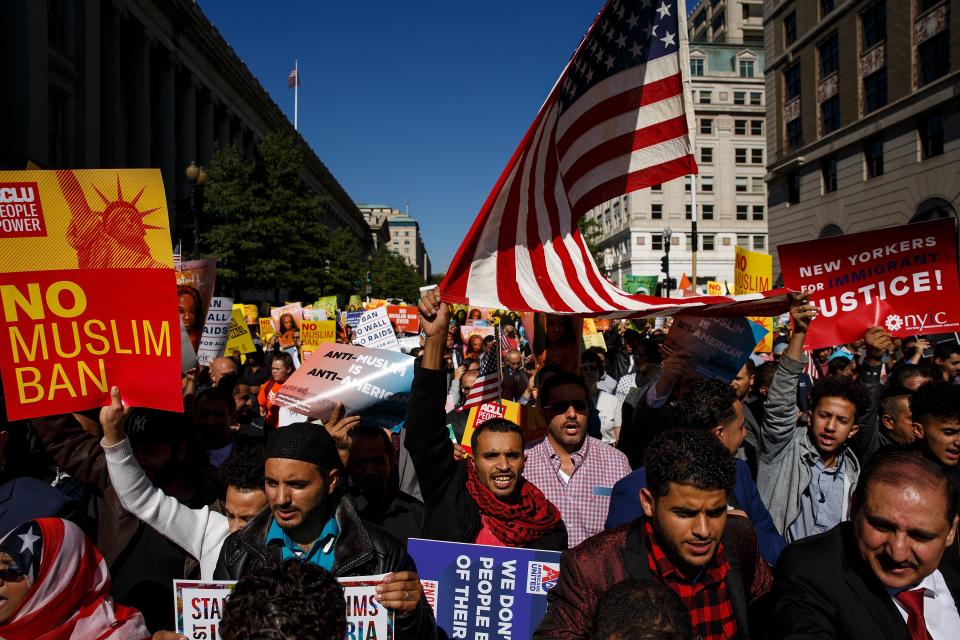 Following a rally in Lafayette Park, activists march toward Trump International Hotel during a protest Oct. 18, 2017, in Washington, D.C., against the Trump administration's third attempt at a travel ban.