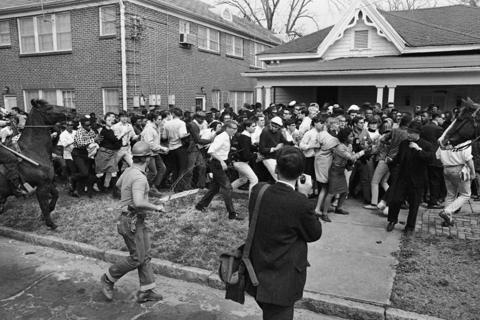 FILE - Mounted police ride into a group of civil rights demonstrators in Montgomery, Ala., March 16, 1965. (AP Photo/Perry Aycock, File)