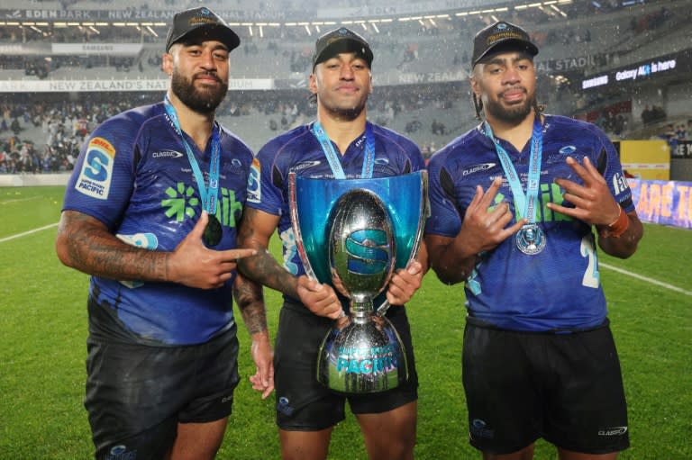 All Blacks Akira Ioane, Rieko Ioane and Hoskins Sotutu (from left) celebrate the Auckland Blues win in the Super Rugby final (MICHAEL BRADLEY)