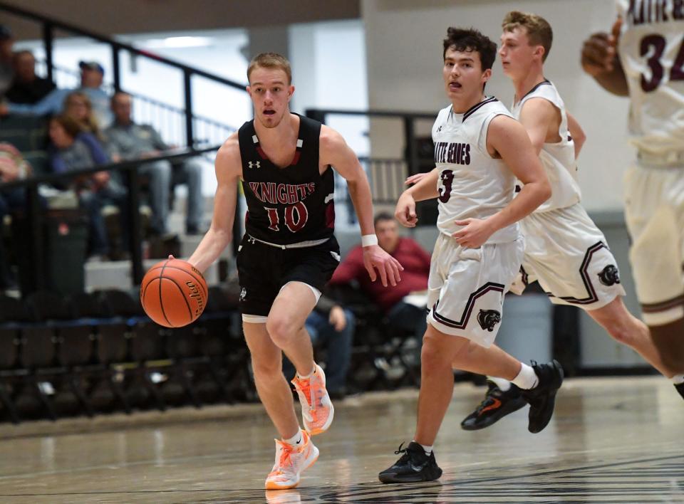 Aberdeen Christian's Malek Wieker dribbles the ball down the court, followed by Platte-Geddes players on Saturday, January 22, 2022, in the Hanson Classic at the Corn Palace in Mitchell.