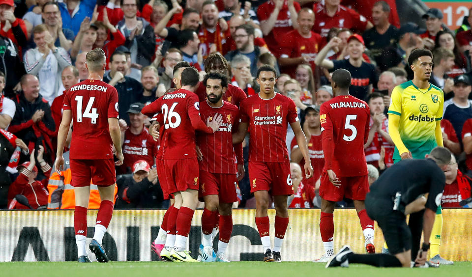 Liverpool's Mohamed Salah (centre) celebrates scoring his side's second goal of the game with his team-mates during the Premier League match at Anfield, Liverpool. (Photo by Martin Rickett/PA Images via Getty Images)