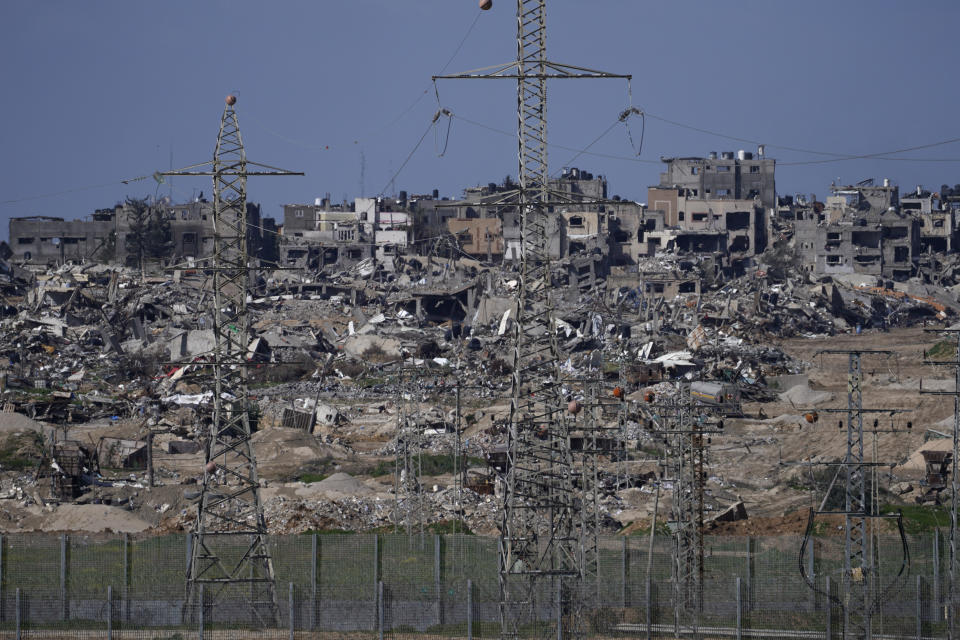 Rubble from buildings destroyed in the Israeli Army's ground operation in the Gaza Strip are seen from southern Israel, near the Gaza border fence, Thursday, Feb. 1, 2024. (AP Photo/Tsafrir Abayov)
