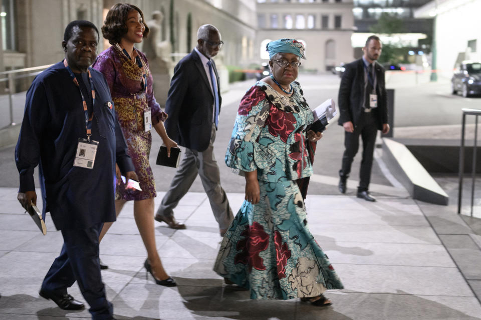World Trade Organization Director-General Ngozi Okonjo-Iweala, front right, arrives at a final meeting during the World Trade Organization Ministerial Conference at the WTO headquarters in Geneva early Friday, June 17, 2022. (Fabrice Coffrini/Pool Photo/Keystone via AP)