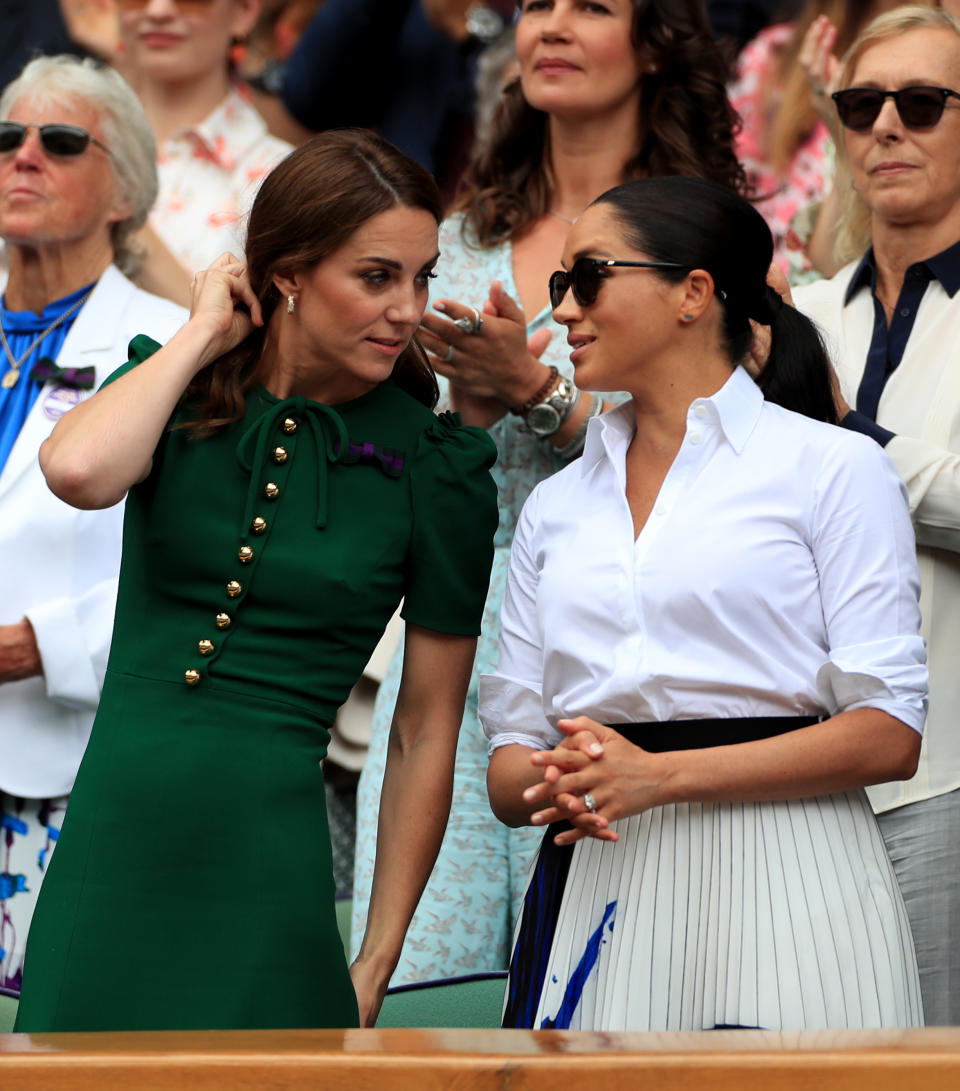 The Duchess of Cambridge and The Duchess of Sussex on day twelve of the Wimbledon Championships at the All England Lawn Tennis and Croquet Club, Wimbledon.