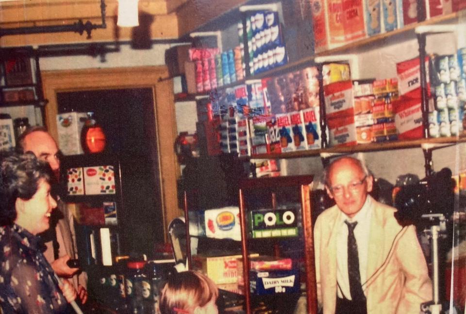 Frank Elliott serves customers in his grocers shop before it closed in 1971 (Image: Courtesy of Tamar Protection Society)