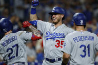 Los Angeles Dodgers' Alex Verdugo (27), Cody Bellinger (35) and Joc Pederson (31) celebrate after Verdugo's two-run home run off Philadelphia Phillies relief pitcher Yacksel Rios during the eighth inning of a baseball game, Monday, July 15, 2019, in Philadelphia. (AP Photo/Matt Slocum)
