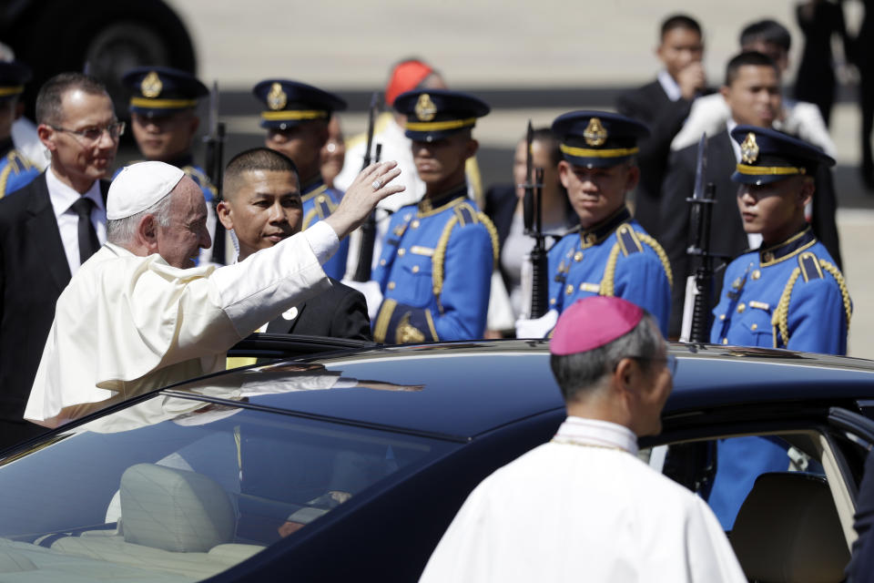 Pope Francis waves as he arrives at Military Air Terminal of Don Muang Airport, Wednesday, Nov. 20, 2019, in Bangkok, Thailand. (AP Photo/Gregorio Borgia)