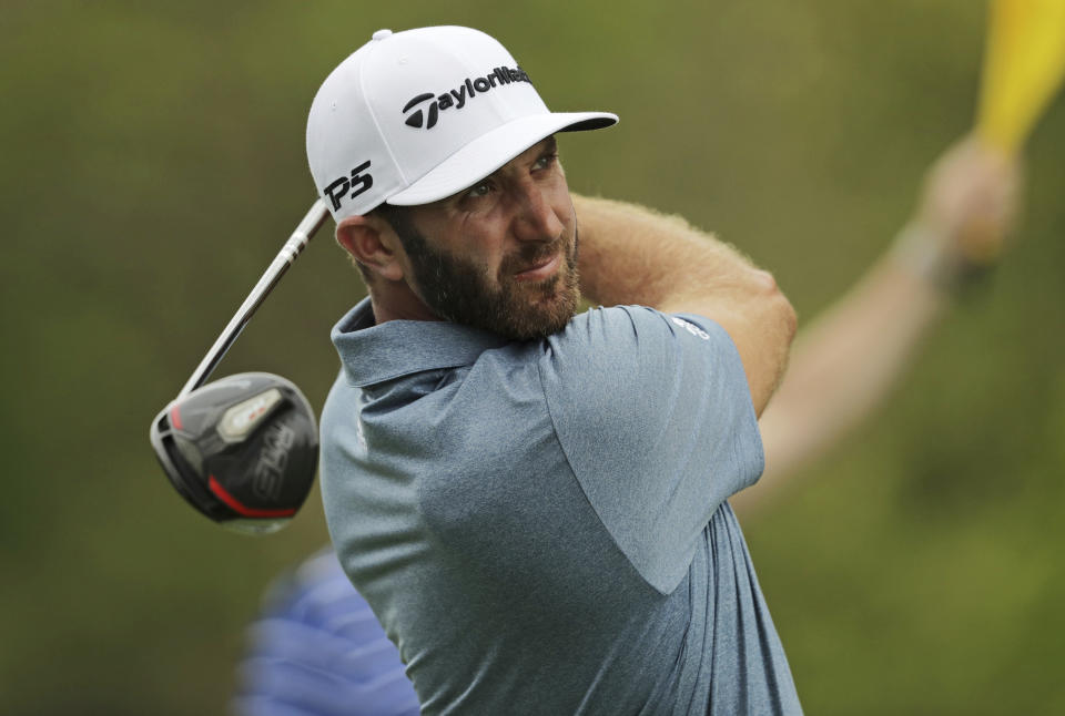 Dustin Johnson drives off the 10th tee during the final round of the PGA Championship golf tournament, Sunday, May 19, 2019, at Bethpage Black in Farmingdale, N.Y. (AP Photo/Charles Krupa)